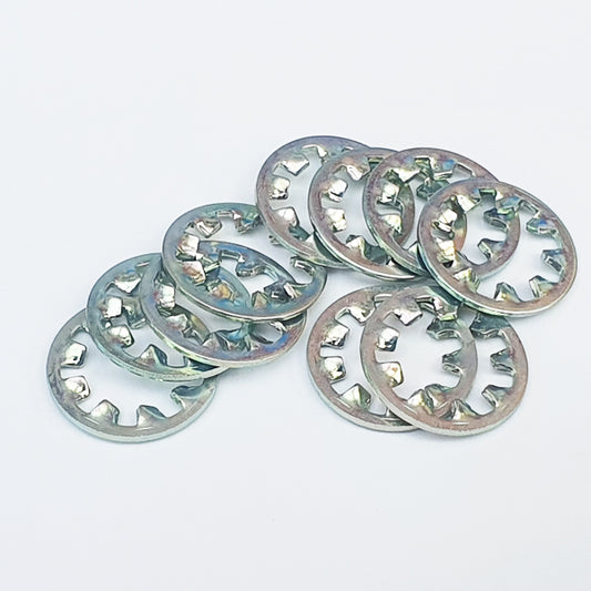 A collection of M6 toothed washers with trivalent white plating, displayed on a white background.