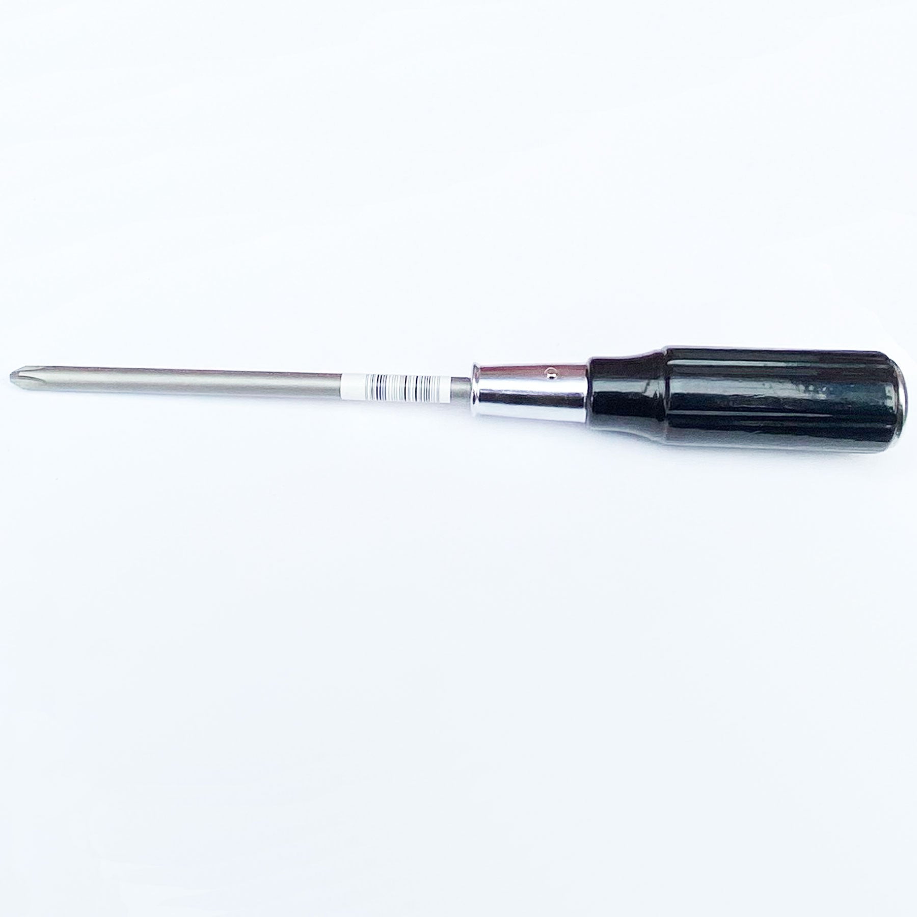 Screwdriver with black handle and silver blade on a white background